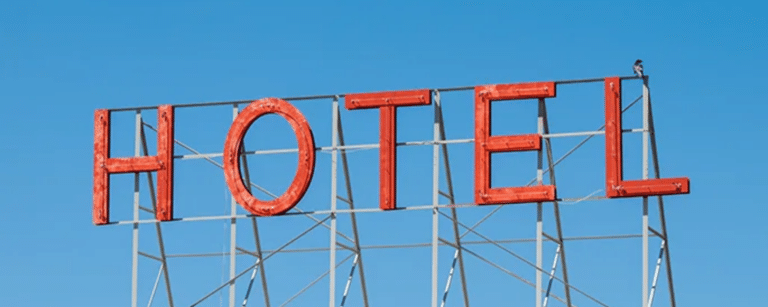 How can capital gains deferral and reinvestment in boutique or traditional hotels be efficiently reconciled in France?