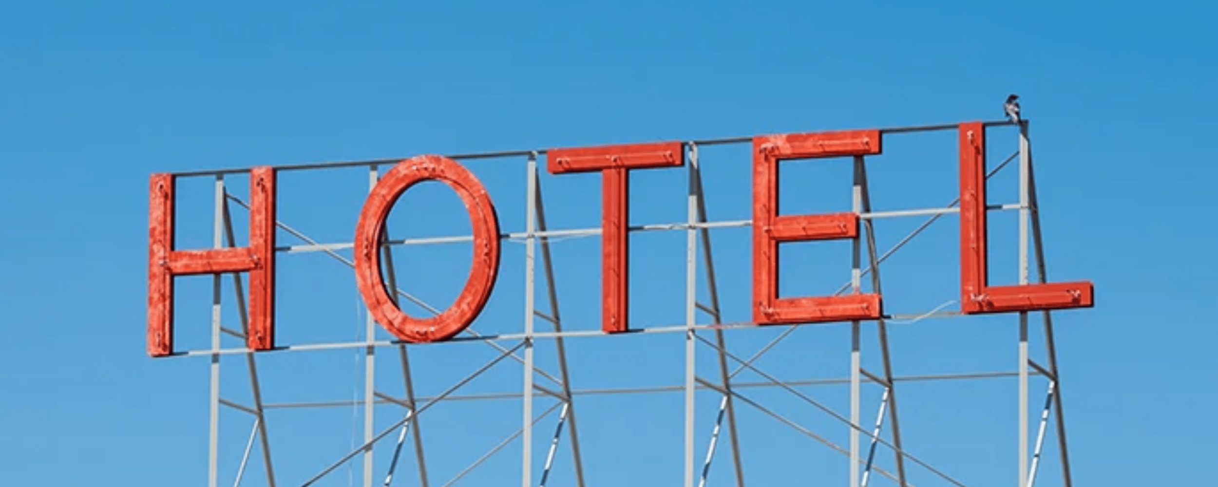 How can capital gains deferral and reinvestment in boutique or traditional hotels be efficiently reconciled in France?